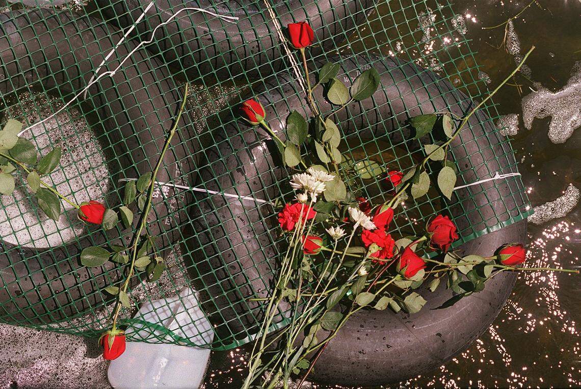 Covered in roses, a replica of the raft from Elian Gonzalez’s voyage in which his mother, Elizabeth Brotons died.