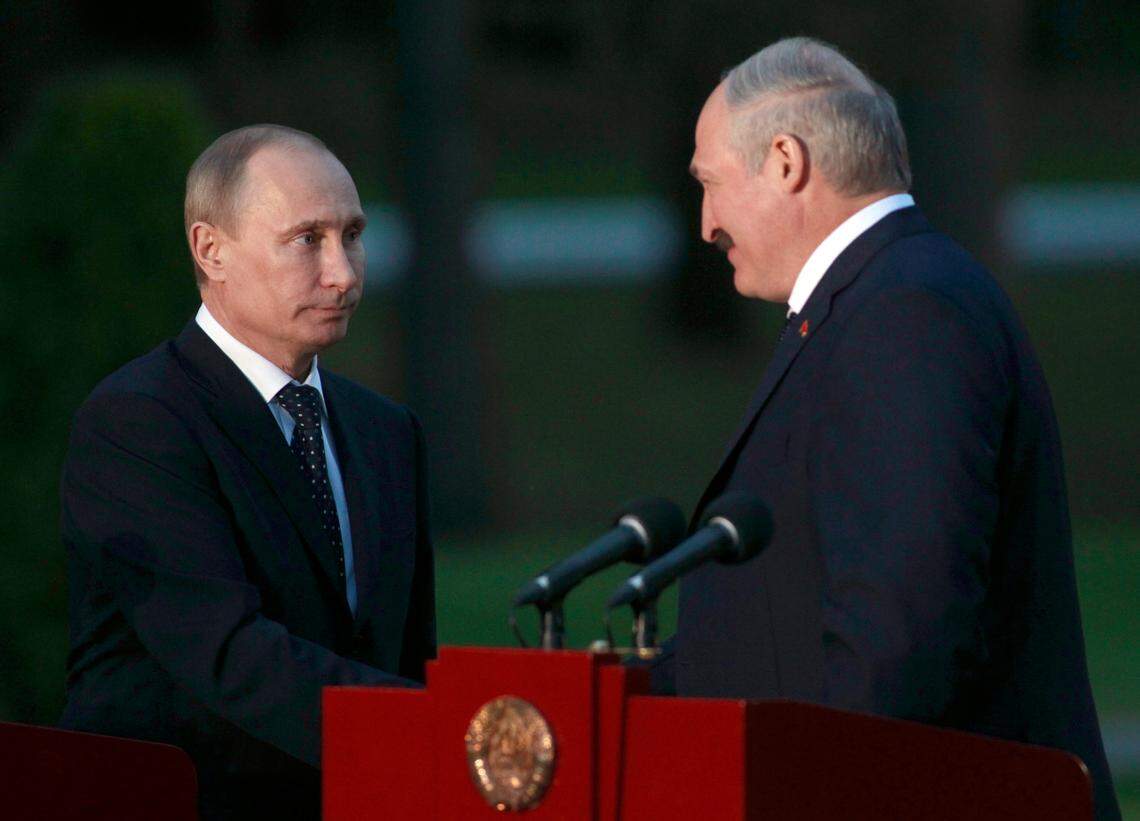 Belarus’ President Alexander Lukashenko, right, and Russian President Vladimir Putin shake hands after their joint statement in the “Zaslavl” government residence, on the outskirts of the Belarus’ capital Minsk, Thursday, May 31, 2012. Russian President Vladimir Putin has arrived on an official visit in Belarus. This is his first official trip abroad after inauguration to the post of President of the Russian Federation (AP/Photo/Sergei Grits, Pool)