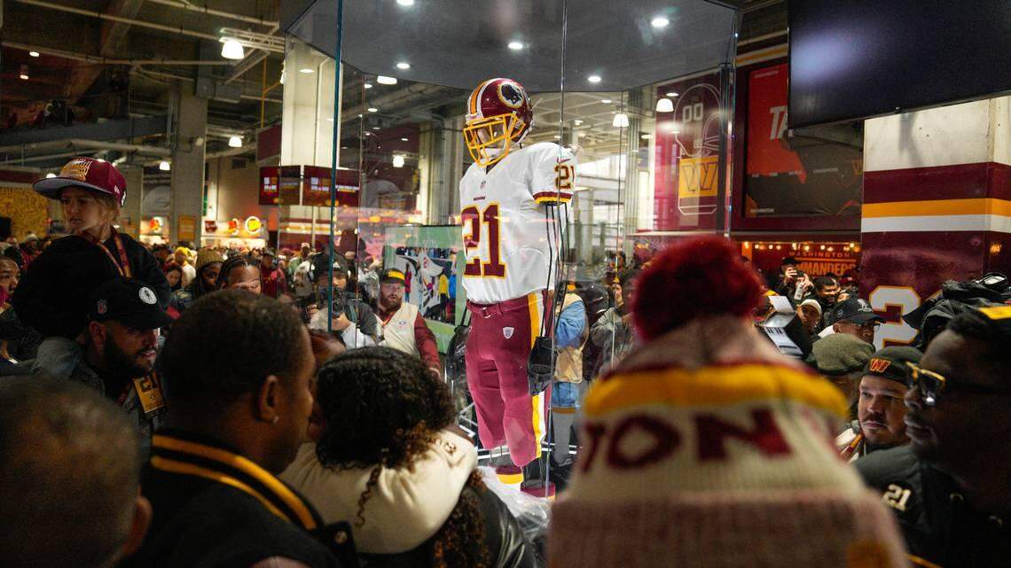 Fans attends the unveiling of the Sean Taylor Memorial, before the start of an NFL football game between the Atlanta Falcons and Washington Commanders, Sunday, Nov. 27, 2022, in Landover, Md. On the 15th anniversary of the death of Taylor, ever Commander player will wear a No. 21 decal on their helmet.