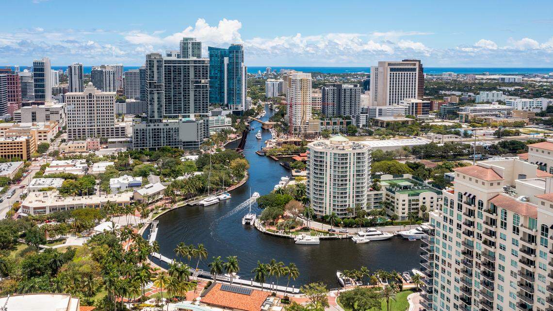 Aerial drone view of Sailboat Bend neighborhood in Fort Lauderdale, view of the North fork new river, yachts, modern buildings, tropical vegetation