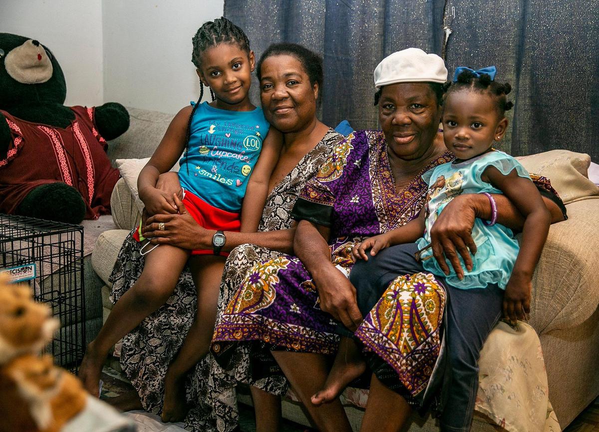 Hortense Mitchell, second from left, with her mother, Viola Richards, and her granddaughters Le’Shay, 5, and Elaine, 2, at their house in Florida City.