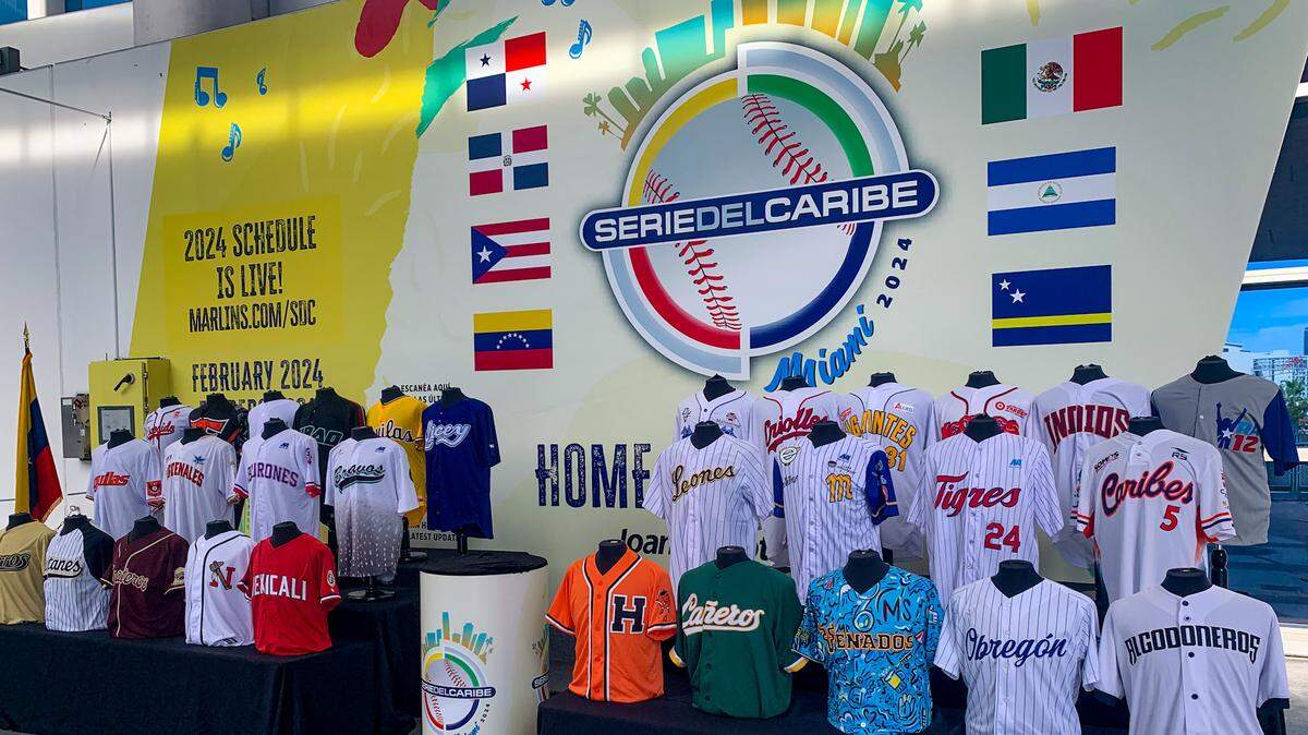 In center field at loanDepot park is a mural celebrating the upcoming Caribbean Series. In front of the mural are jerseys from the teams that participate in the professional baseball winter leagues in the Caribbean Professional Baseball Confederation (Venezuela, the Dominican Republic, Puerto Rico and Mexico).
