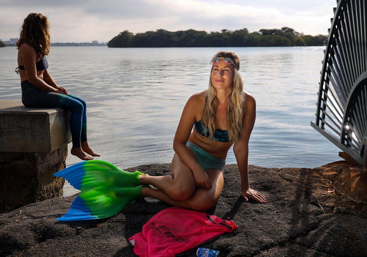Merle Liivand, looking on from the shore, is a former Baltic States Champion in the 100- and 200-meter breaststroke and also a member of the Estonian National Swim Team.