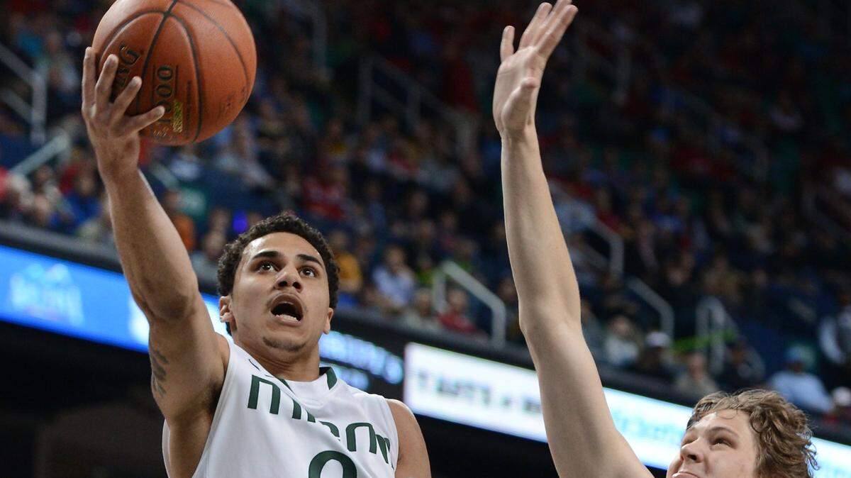 Back in 2013, then Miami Hurricanes guard Shane Larkin (0) goes in for two.