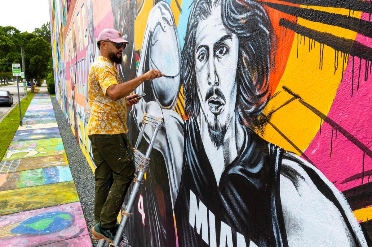 Muralist Kyle Holbrook includes a portrait of rookie Jaime Jaquez Jr. to his Miami Heat inspired mural in the Wynwood neighborhood of Miami, Florida, on Thursday, November 2, 2023. Holbrook opened his non-profit Moving the Lives of Kids Community Mural Project (MLK Mural) in 2002.