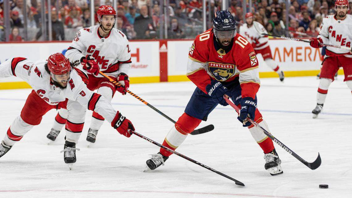 Florida Panthers left wing Anthony Duclair (10) competes for the puck against Carolina Hurricanes defenseman Jalen Chatfield (5) in the second period of Game 4 of the NHL Stanley Cup Eastern Conference finals series at the FLA Live Arena on Wednesday, May 24, 2023 in Sunrise, Fla.