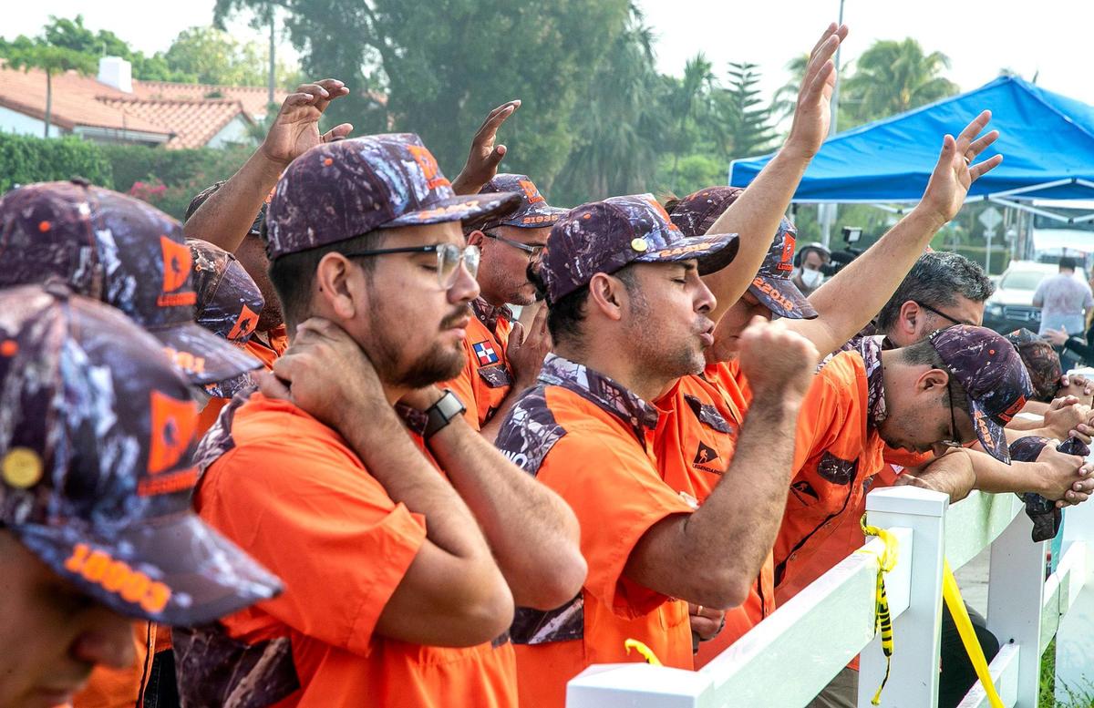 Members of the Cristian group called Legendarios pray for the victims and the families of the Champlain Towers South Condo that collapsed last Thursday June 24th. The search and rescue continue through Saturday early morning.The building is located at 8777 Collins Avenue in Surfside, that collapsed Thursday morning, on Saturday, June 26, 2021.