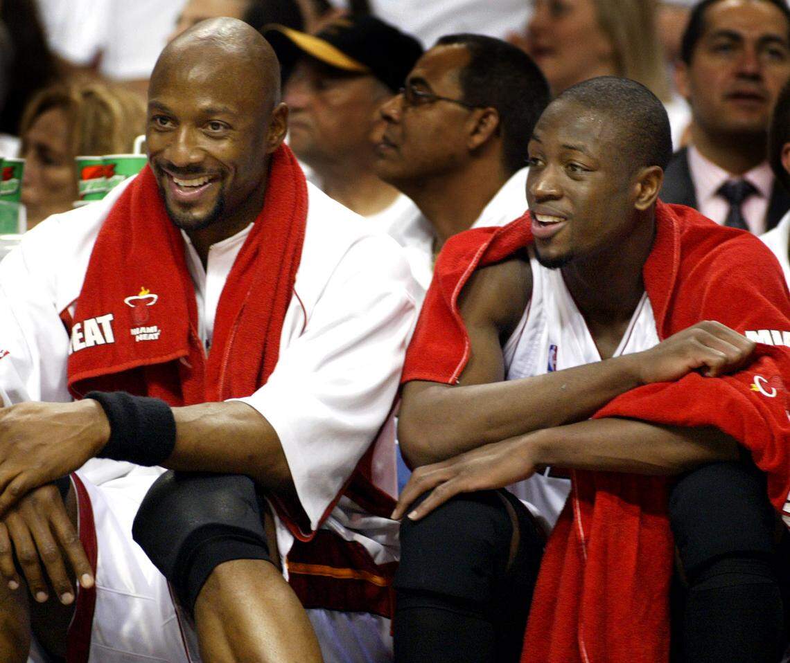 Alounzo Mourning and Dwayne Wade sit happily on the bench during the final minutes of the fourth quarter against the Nets on May 10, 2006.
