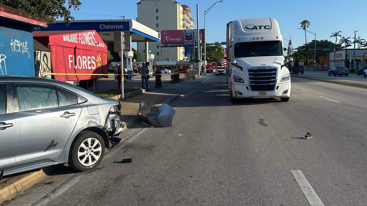 A woman standing on a sidewalk was critically injured when an 18-wheeler smacked a car from behind, causing the smaller vehicle to jump the curb and hit her near the Northwest 27th drawbridge in Miami on Wednesday, March 24, 2024, police said.