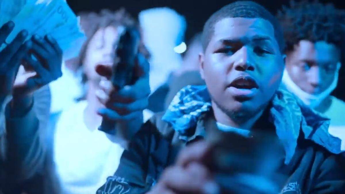 Chrisey Pressley, shown here on a music video he posted on YouTube, is accused of brandishing a firearm at the Aventura Mall on May 8, 2021.