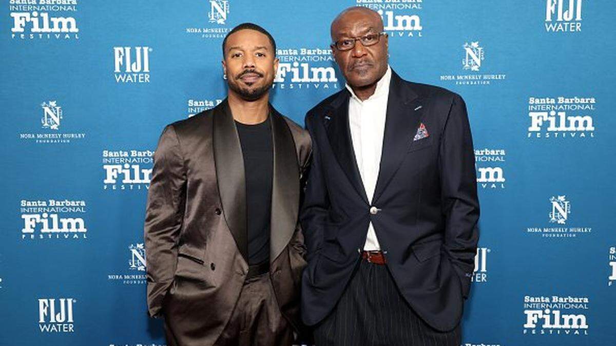 SANTA BARBARA, CALIFORNIA - FEBRUARY 12: (L-R) Michael B. Jordan and Delroy Lindo with FIJI Water at the 41st Annual Santa Barbara International Film Festival: Outstanding Performer Award honoring Michael B. Jordan at The Arlington Theatre on February 12, 2026 in Santa Barbara, California. (Photo by Phillip Faraone/Getty Images for FIJI Water)