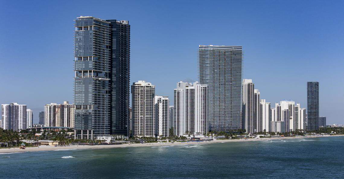 An aerial view of the Turnberry Ocean Club Condo, left, as it sits near the coastline on Friday, Oct. 31, 2025, in Sunny Isles Beach, Fla.