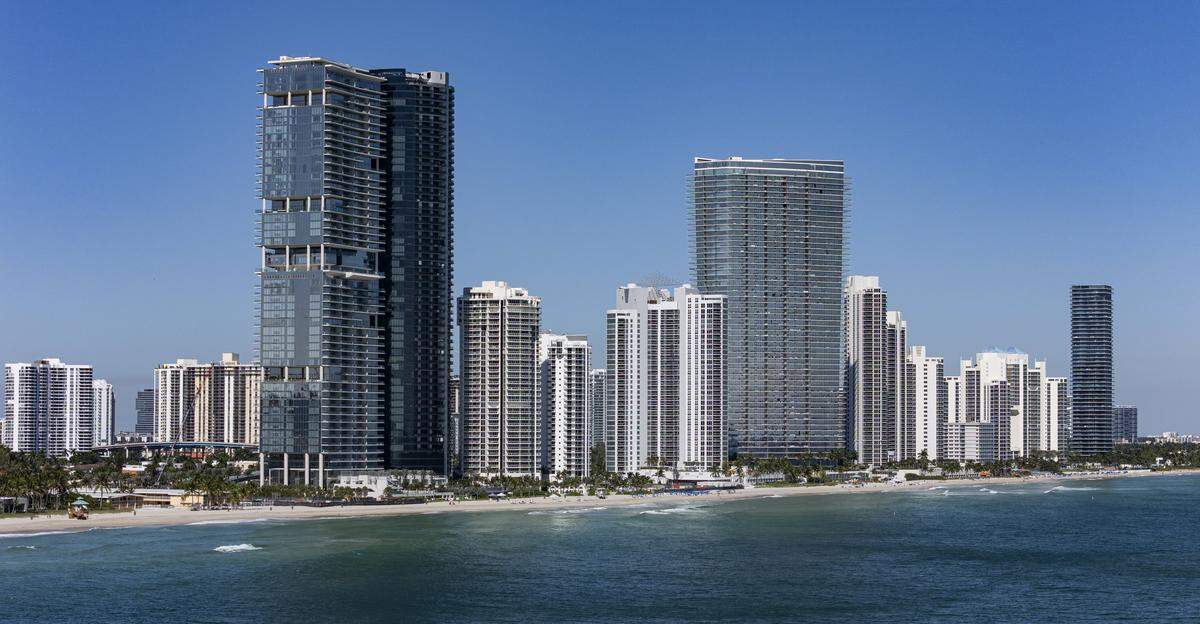 An aerial view of the Turnberry Ocean Club Condo, left, as it sits near the coastline on Friday, Oct. 31, 2025, in Sunny Isles Beach, Fla.