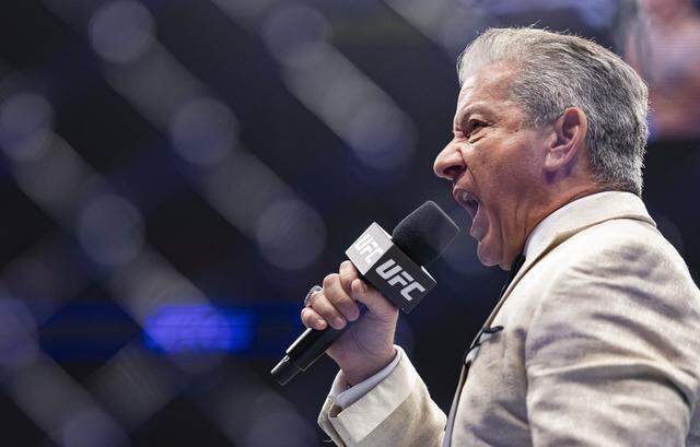 UFC Ring Announcer Bruce Buffer speaks before Charles Radtke of the United States and Francisco Prado of Argentina fight in their welterweight bout at UFC 327 at the Kaseya Center on Saturday, April 11, 2026, in downtown Miami, Fla.