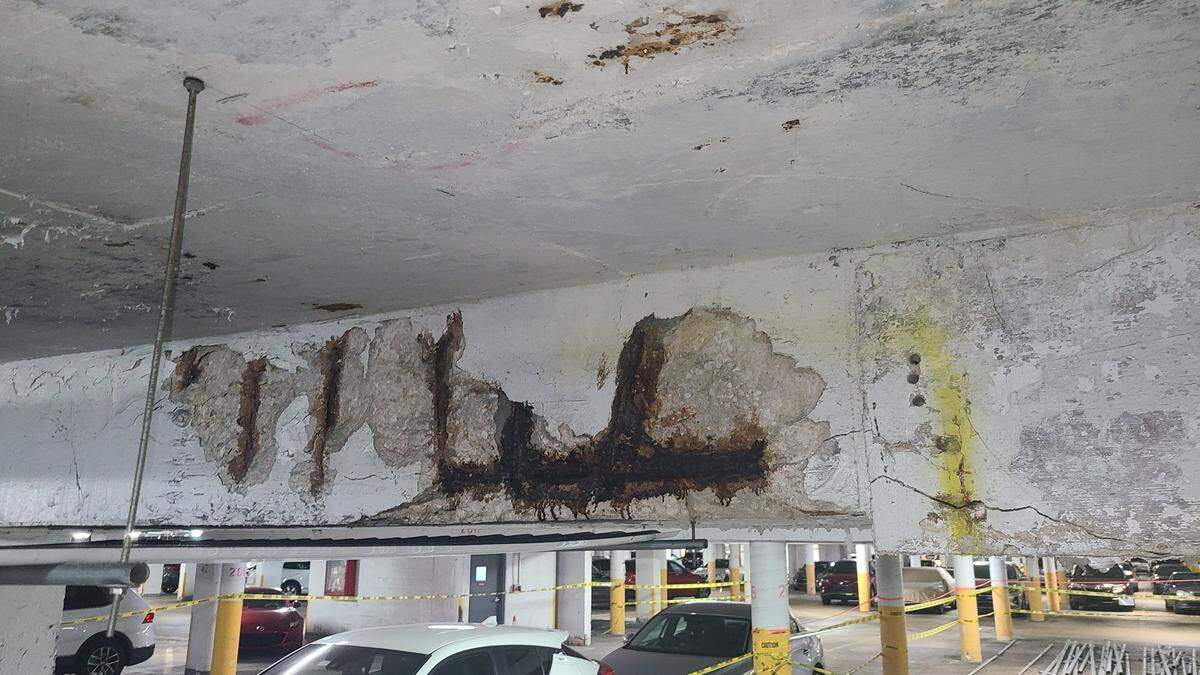 Photos captured by a resident of the Maison Grande Condominium at the building’s parking garage show concrete damage, rusty rebar.