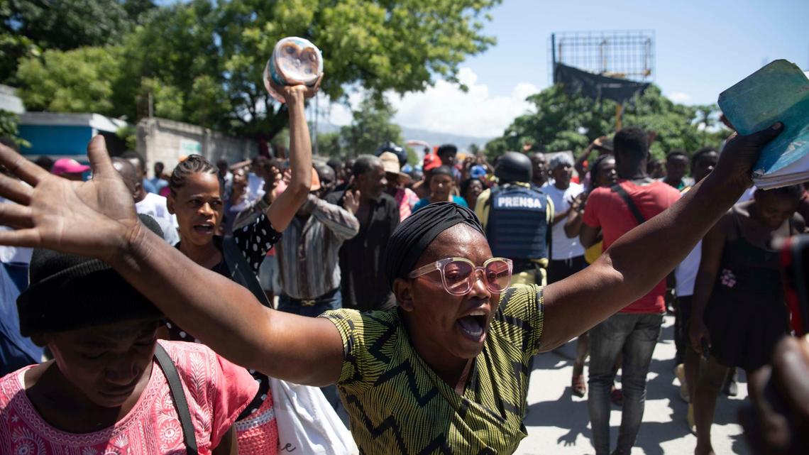 Demonstrators march demanding peace and security in La Plaine neighborhood of Port-au-Prince, Haiti, Friday, May 6, 2022. Escalating gang violence has prompted Haitians to organize protests to demand safer neighborhoods.