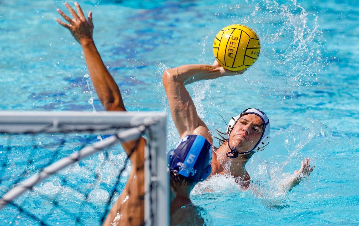 Gabriel Lewis (8) attempts to score as Dr. Phillips High School’s Ryan Tannus (5) defends during the Boys Florida High School Water Polo State Championships at Belen Jesuit Preparatory School in Miami, Florida on Saturday, April 20, 2024.