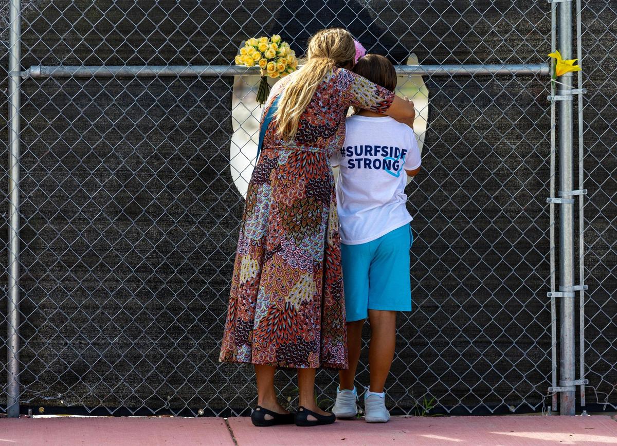 People visit the site of the Champlain Towers South building collapse before the Second Annual Remembrance Ceremony at Veterans Park on Saturday, June 24, 2023, in Surfside, Florida.