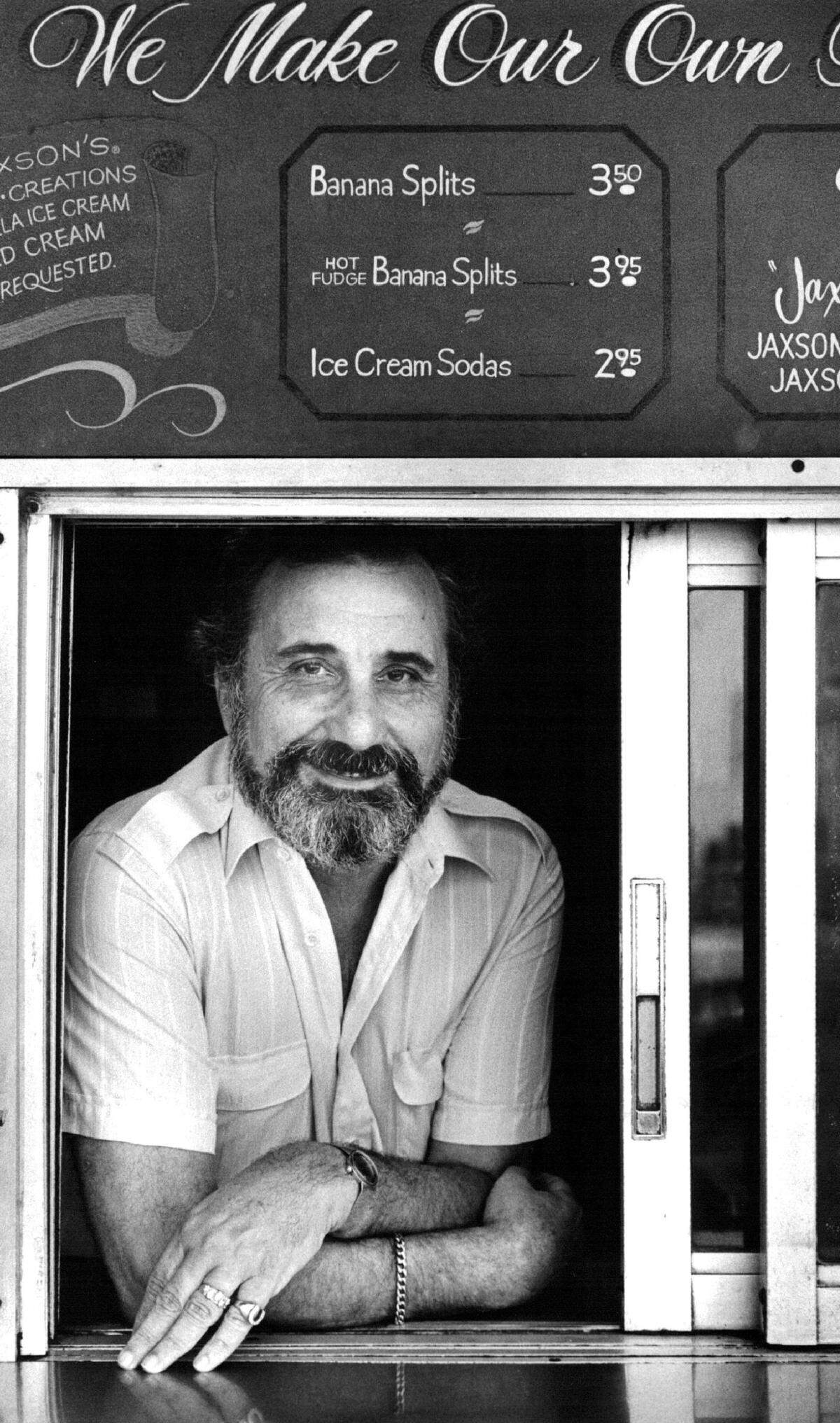 Monroe Udell, founder of Jaxson’s Ice Cream, peers through the ice cream takeout window in 1985.