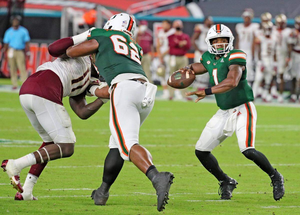 UM’s quarterback D’Eriq King (1) throws the ball as offensive lineman Jarrid Williams (62) blocks FSU’s Warren Thompson (11) in a Sept. 26 game.