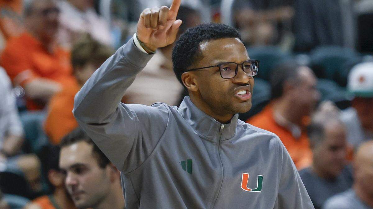 Miami Hurricanes head coach Jai Lucas signals towards the court during the second half of an NCAA basketball game against the Georgia Tech Yellow Jackets at the Watsco Center on the University of Miami Campus on Saturday, January 10, 2026 in Coral Gables, Florida.