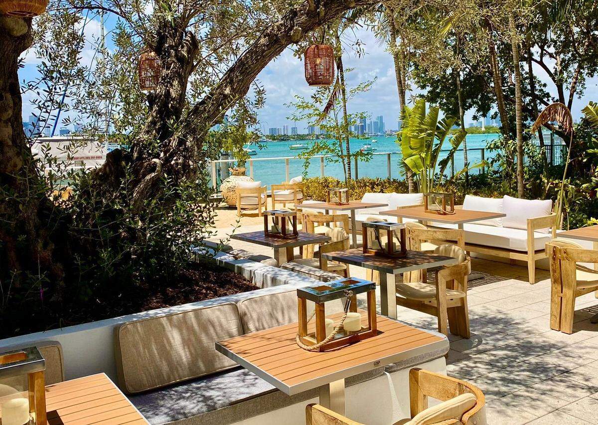 The outdoor patio at the waterfront restaurant Pamplemousse on the Bay in Miami Beach.