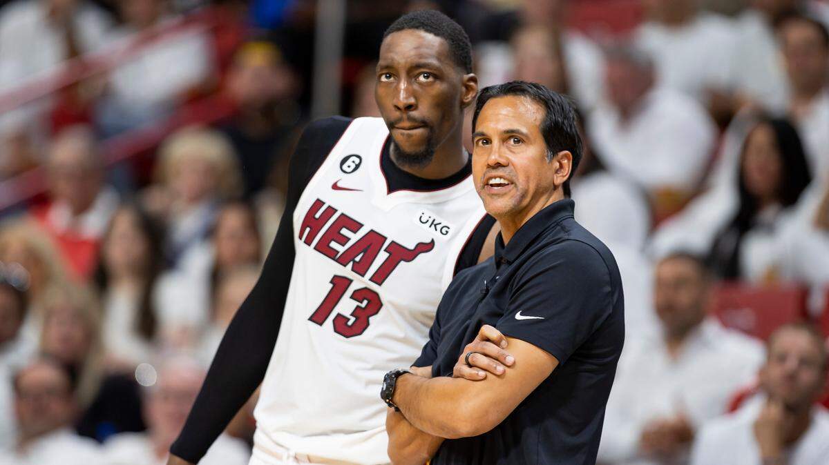 Miami Heat center Bam Adebayo (13) and head coach Erik Spoelstra talk on the sidelines in the fourth quarter of Game 4 of the NBA Eastern Conference Semifinals at the Kaseya Center in Miami on Monday, May 8, 2023.