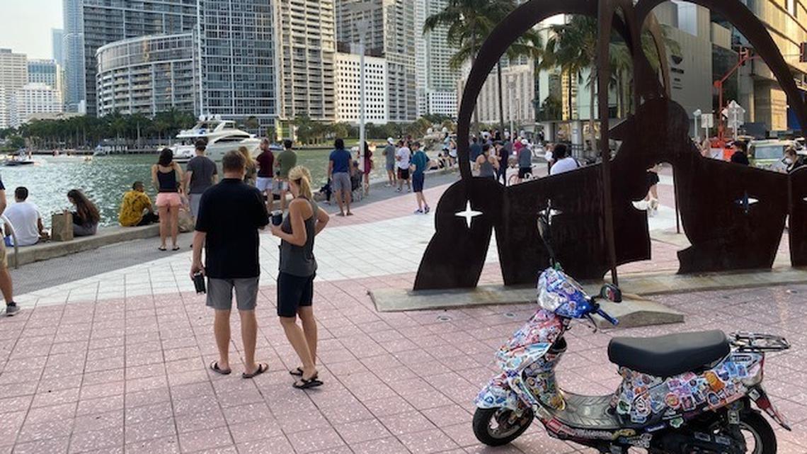 Miami residents amassed near One Miami Condo, 325 S. Biscayne Blvd., to hear David Guetta’s two-hour show, which drew 25 million online viewers and raised more than $700,000 for relief efforts around the world. Miami police dispersed the downtown crowd.