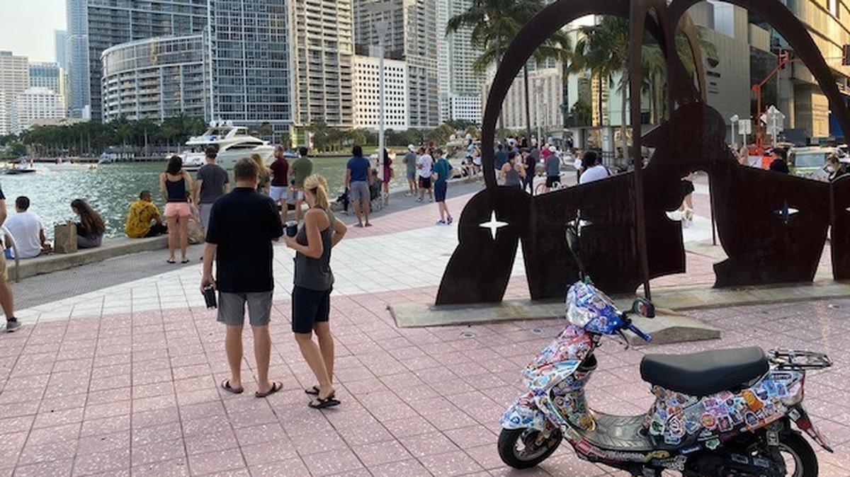 Miami residents amassed near One Miami Condo, 325 S. Biscayne Blvd., to hear David Guetta’s two-hour show, which drew 25 million online viewers and raised more than $700,000 for relief efforts around the world. Miami police dispersed the downtown crowd.