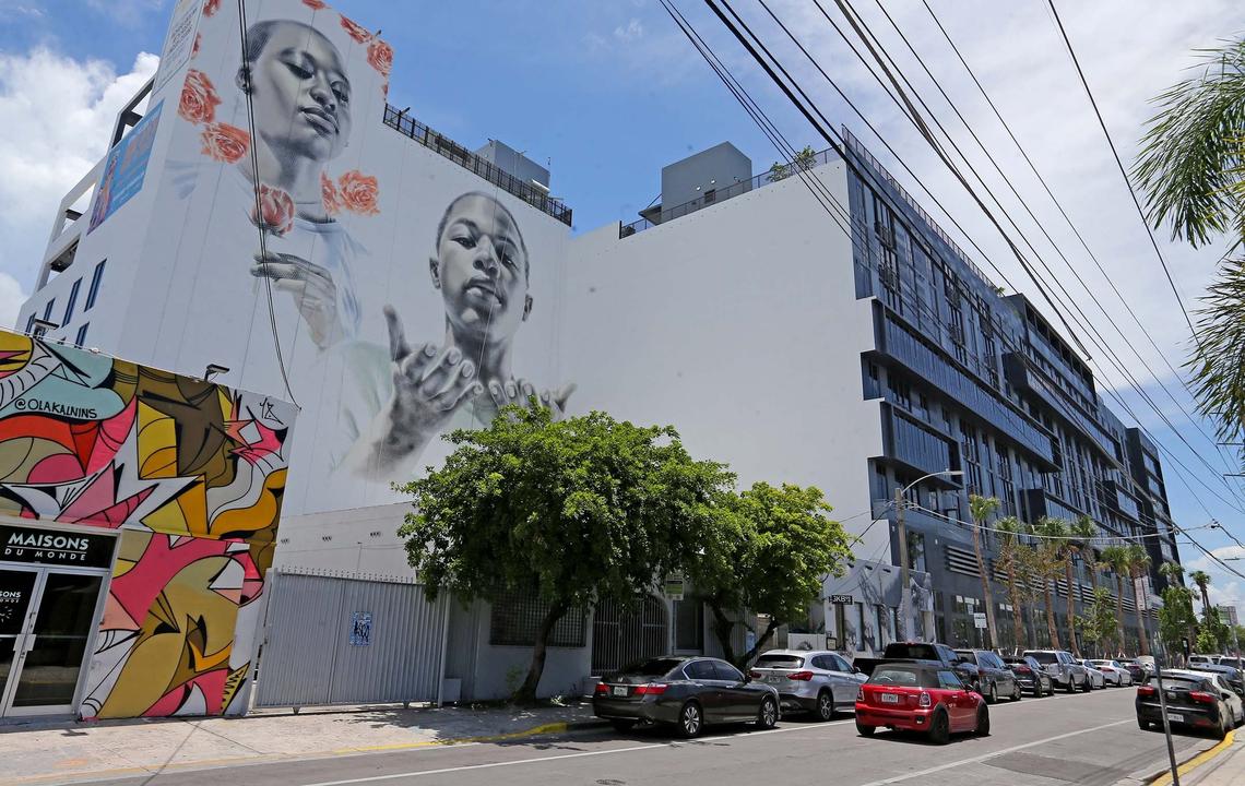 A seven-story mural by the Los Angeles-based artist El Mac adorns the side of the Wynwood 25 building, overlooking Wynwood Walls.