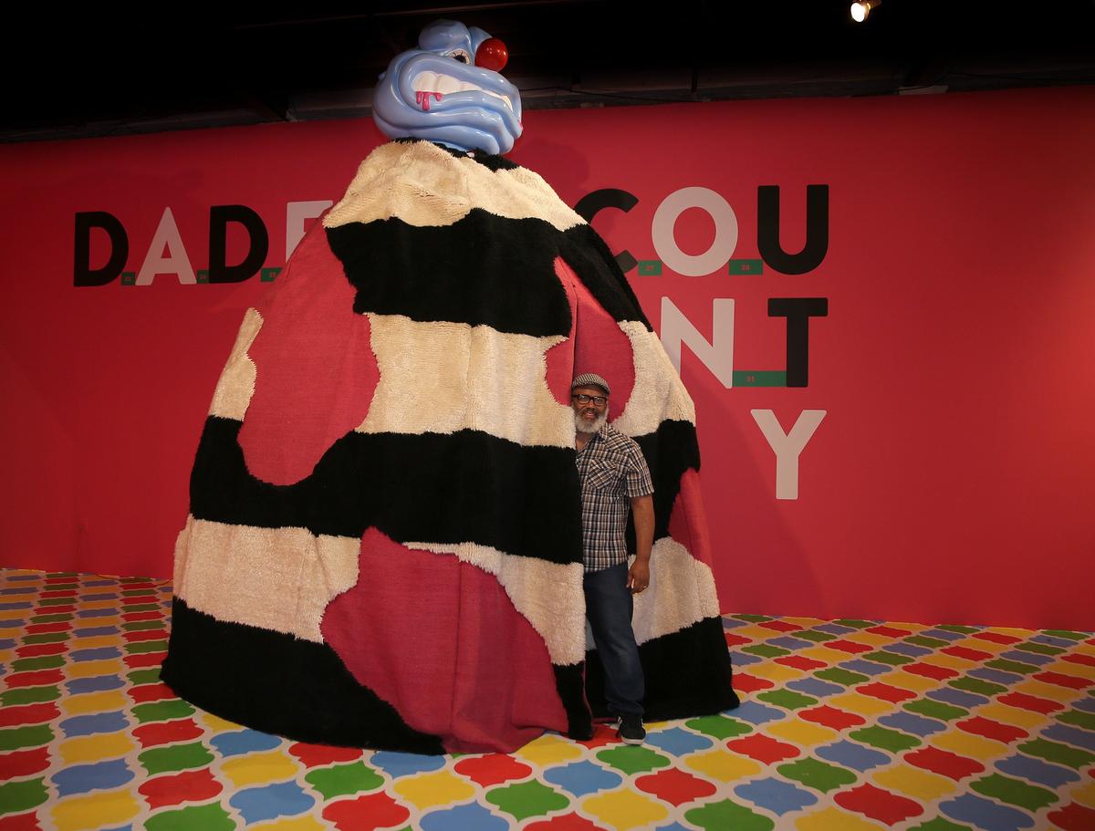 Artist Trenton Hancock Doyle comes out of his piece ‘mound #1 the legend’ at his exhibit “I Made a Mound City in Miami Dade County.”