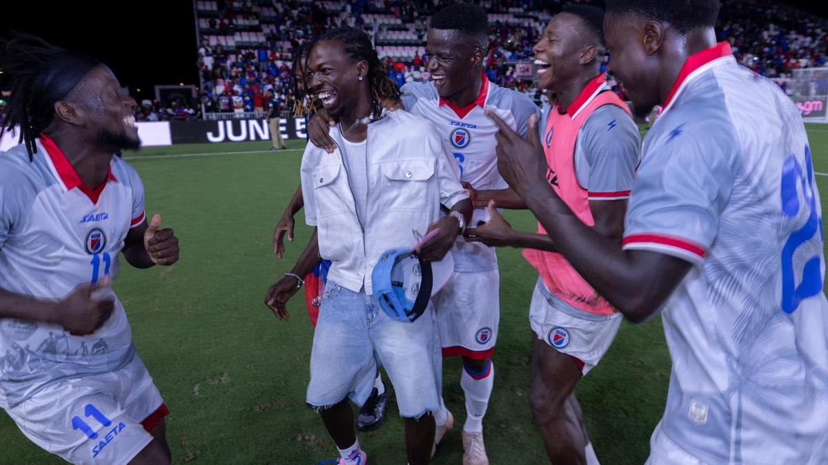 Woodensky Pierre, midfielder of the Haitian national team, is greeted by teammates after arriving in Fort Lauderdale on Tuesday, June 2, 2026, in time to see the team rout New Zealand, 4-0, in a pre-World Cup friendly game. Pierre’s arrival in the United States had been delayed because of issues in securing a U.S. visa.