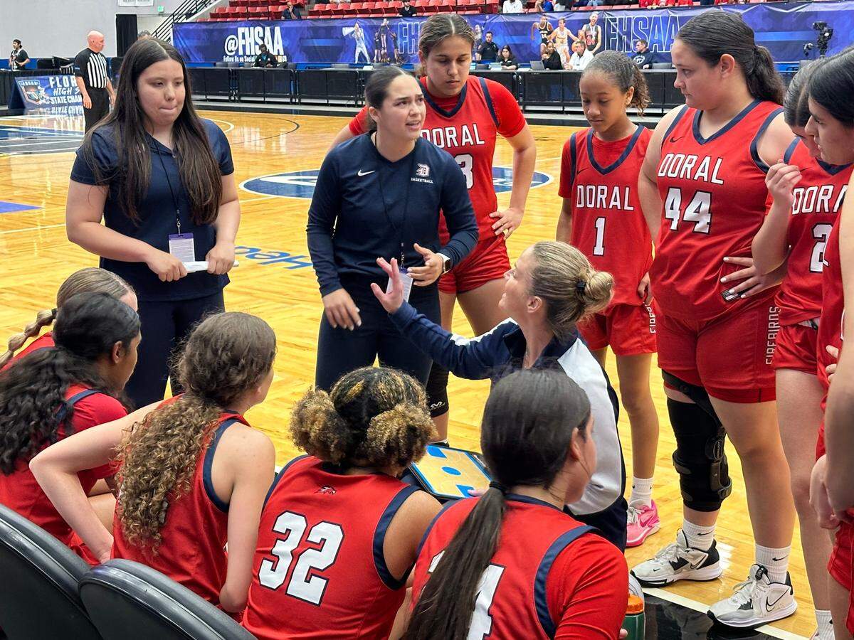 Doral Academy girls basketball coach Allison Bustamante coaches her players during a timeout last March in the Class 7A state semifinals against Orlando Colonial at RP Funding Center.