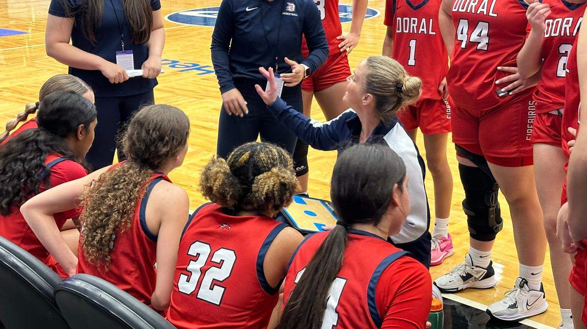 Doral Academy girls basketball coach Allison Bustamante coaches her players during a timeout on Friday morning in the Class 7A state semifinals against Orlando Colonial at RP Funding Center.
