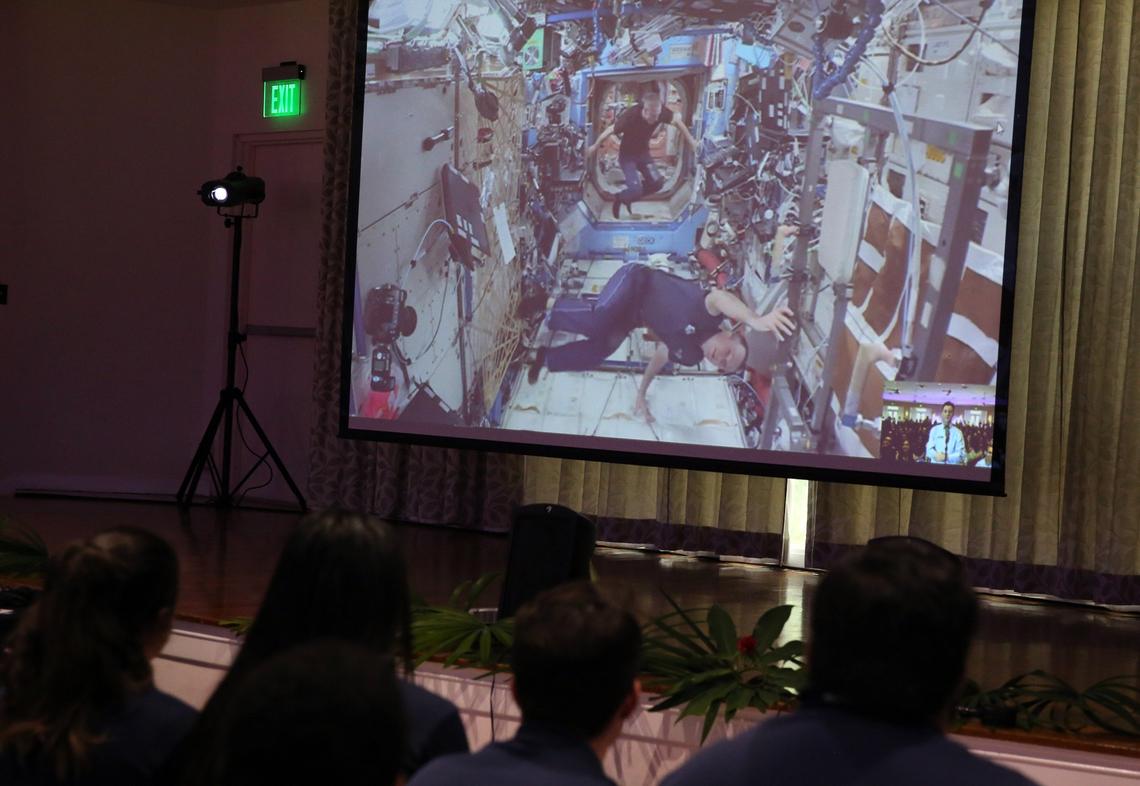 Astronauts Ricky Arnold and Drew Feustel float into the camera frame before the start of a live feed from the International Space Station, Wednesday morning, April 25, 2018, at Fairchild Tropical Botanic Garden in Coral Gables.