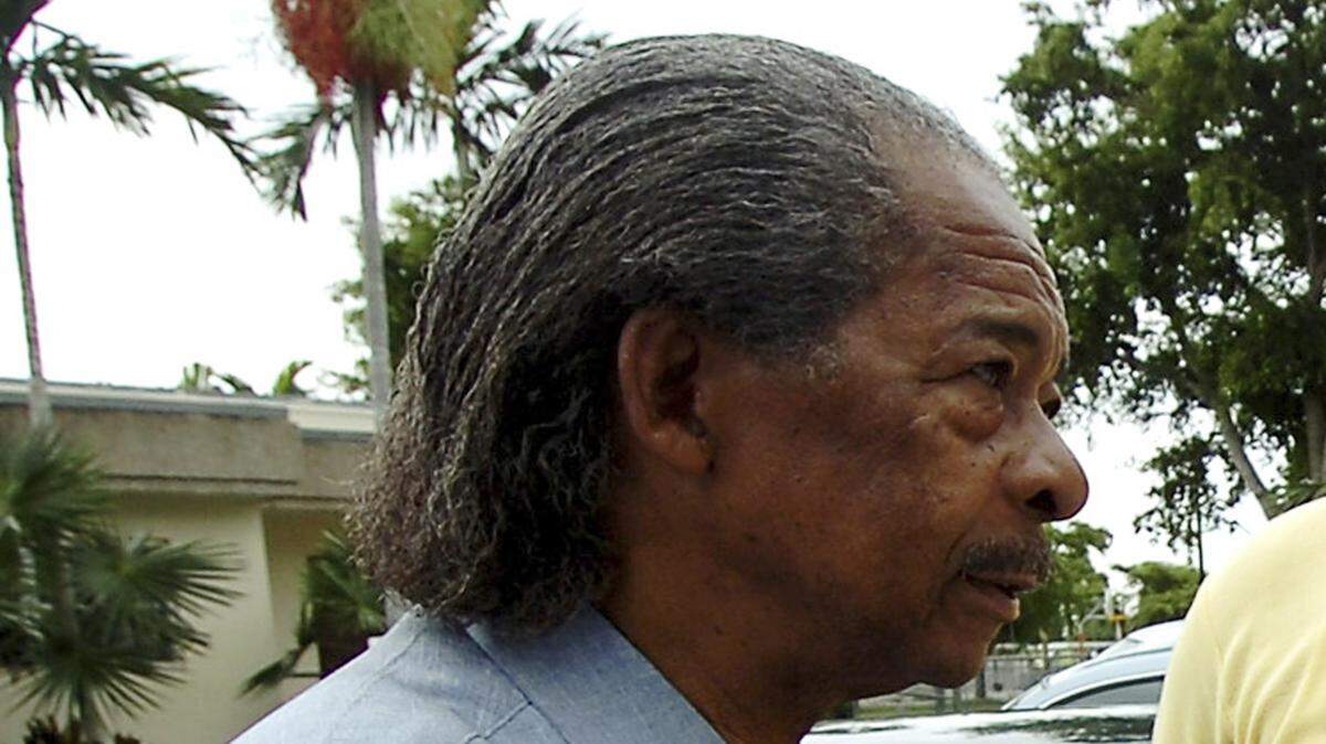 FILE - In this Tuesday, Nov. 7, 2006, file photo, then-District 2 school board candidate Solomon Stinson campaigns during a rally stop at Sunkist Grove Community Center in North Miami, Florida. Police in Florida say that Stinson, an 81-year-old former Miami-Dade educator and school board member, shot at officers during a chase before crashing his car, Sunday, June 2, 2019. (AP Photo/Steve Mitchell, File)