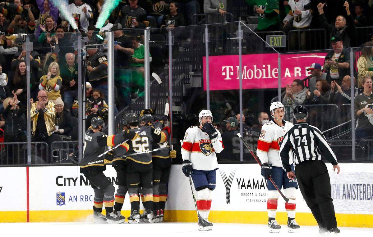 Florida Panthers’ Sam Bennett (9) and Mason Marchment, right, skate away as the Vegas Golden Knights celebrate a goal by center Brett Howden during the first period of an NHL hockey game Thursday, March 17, 2022, in Las Vegas. (AP Photo/Steve Marcus)