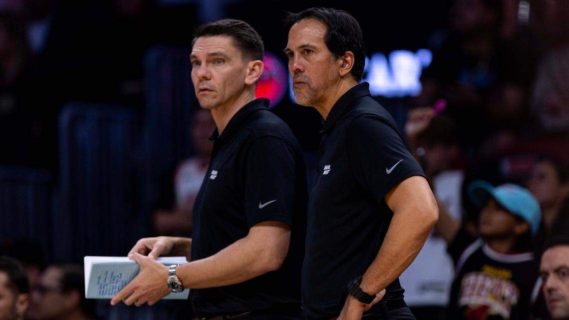 Miami Heat head coach Erik Spoelstra and assistant coach Chris Quinn on the sideline during the second half of an NBA game against the Orlando Magic at Kaseya Center on January 27, 2025, in Miami.