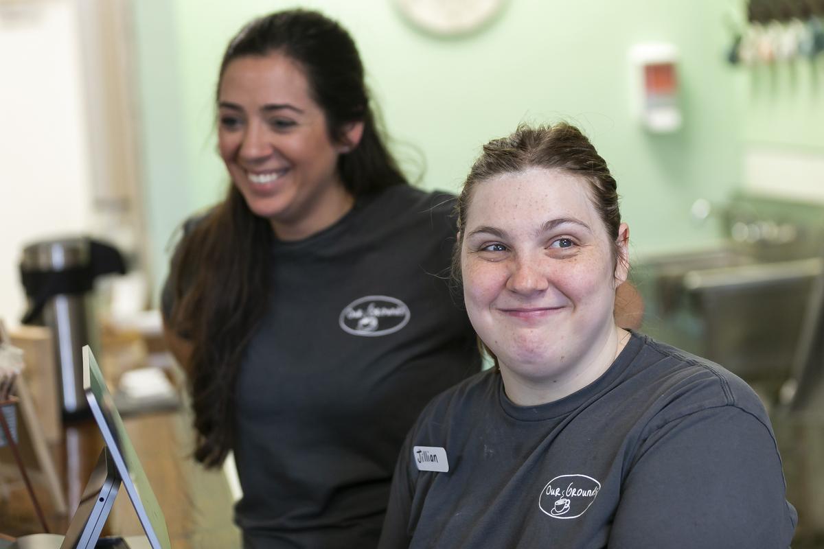 Jillian Joerg, 29, (right) a cashier, greets customers and takes orders at Our Grounds in Kendall, Florida. Vanessa Vila, left, founded Our Grounds as a training place for people with developmental disabilities. It an extension of her career as an occupational therapist.