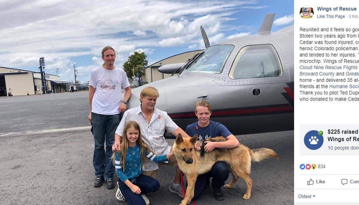 (From left to right) Chloe, Doug and Chase Peterson greet their long-lost German Shepherd dog Cedar on Saturday afternoon at Fort Lauderdale Executive Airport. Cedar, 2, was stolen from her home in Southwest Ranches in 2017 and located this month in Colorado.