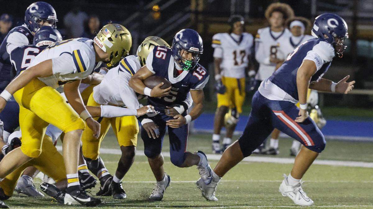 Columbus Explorers running back Shawn James (15) carries the ball against St. Thomas Aquinas Daniel Norman (11) in the first half at Tropical Park Stadium in Miami, Florida, on Friday, September 5, 2025.