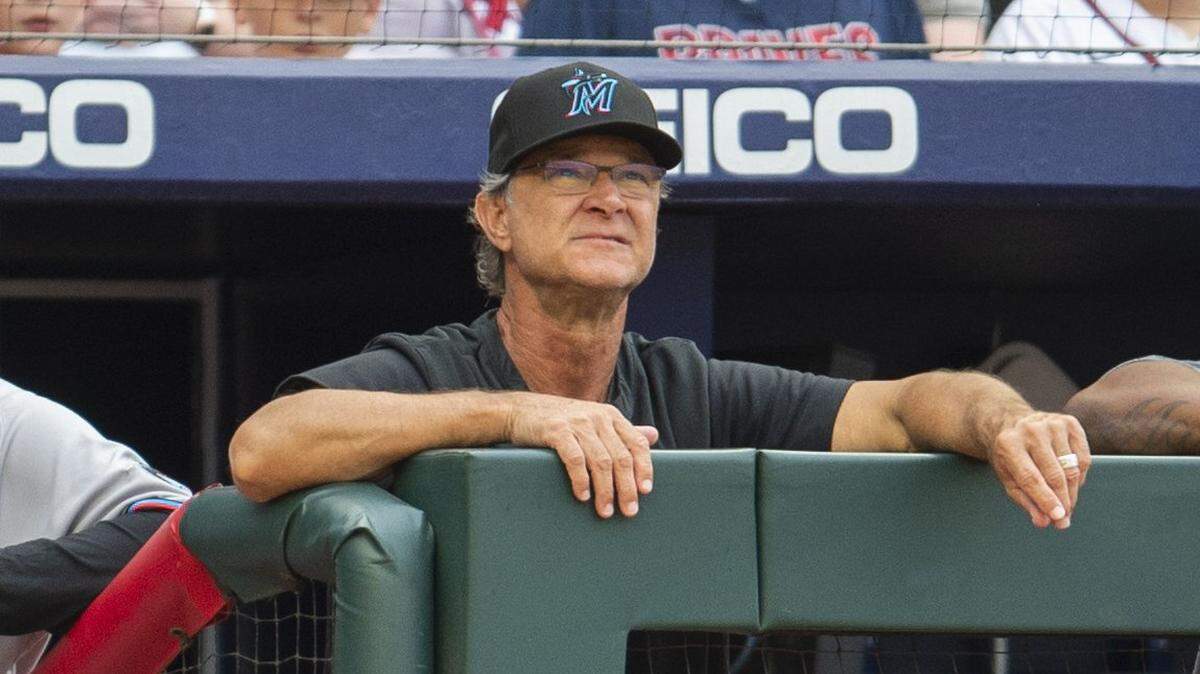 Miami Marlins manager Don Mattingly watches from the dugout in the first inning of a baseball against the Atlanta Braves, Sunday, Sept. 4, 2022, in Atlanta. (AP Photo/Hakim Wright Sr.)