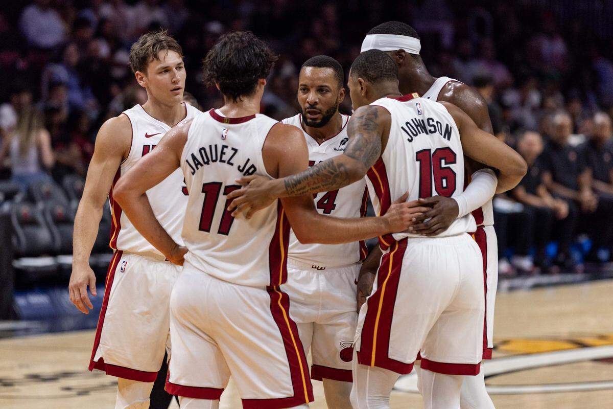 Miami Heat players huddle during the second half of an NBA preseason game against the San Antonio Spurs at Kaseya Center on Wednesday, October 8, 2025, in Miami, Fla.