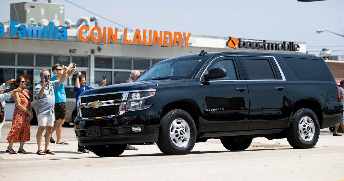 Former President Donald Trump’s motorcade, heading to Palm Beach International Airport, makes its way past a rally on Monday, April 3, 2023, in West Palm Beach, Florida.