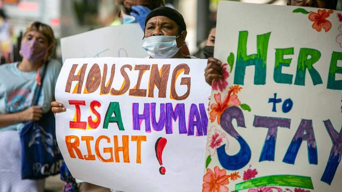 Residents at a rally in downtown Miami in July 2021, demanding policies that better protect renters from predatory landlords.