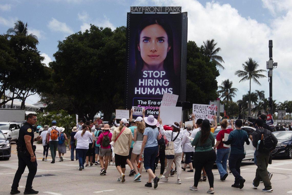 Protesters gather at the Torch of Friendship in Miami on Saturday, during a demonstration opposing the policies of President Donald Trump. Thousands gathered at events in Miami and Hollywood that were part of hundreds of protests around the country.