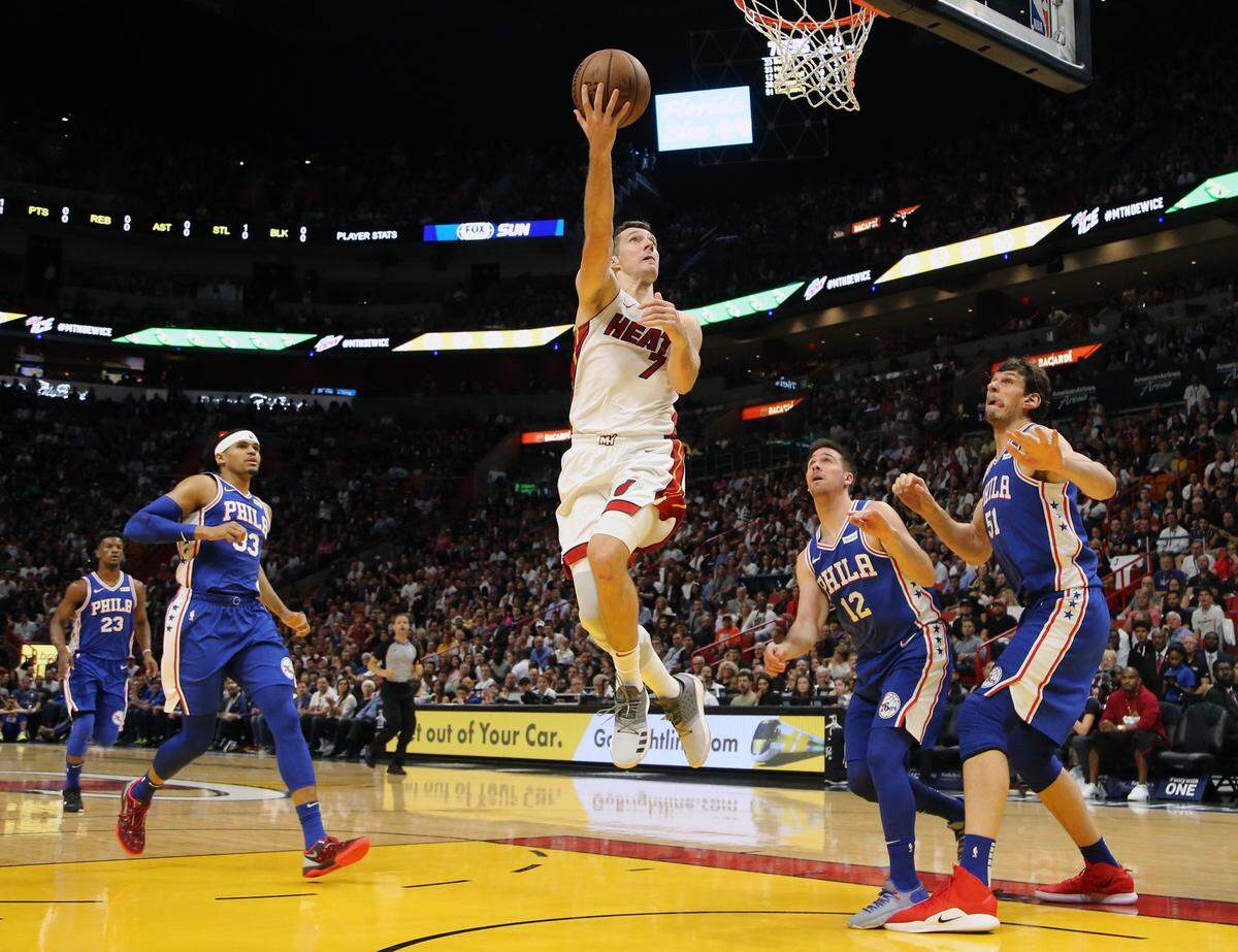Goran Dragic (7) attempting a layup in the third quarter as the Miami Heat hosts the Philadelphia 76ers at AmericanAirlines Arena on April 9, 2019.