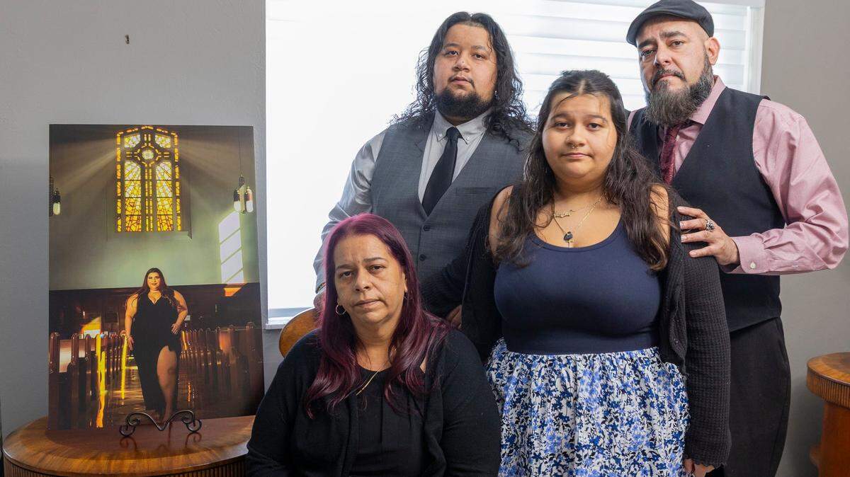 On Friday, June 20, 2025, in Homestead, Florida, Kristy Garcia, 46, sits beside her brother Bruce Figueroa, 52, and her children Jocelyn Valdes, 17, and Jose Valdes, 25, as they gather near a portrait of Evelyn Valdes, 28, daughter and sister, whose life was tragically taken in a recent shooting on June 14, 2025, in Wynwood, Florida.