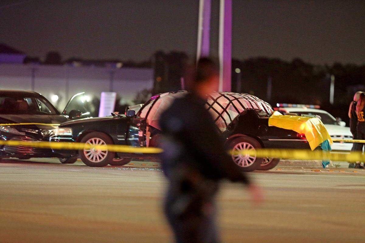 The vehicle of motorist Richard Cutshaw, who was killed by a stray bullet, remained part of the crime scene after a UPS delivery truck robbery in Coral Gables ended in a shooting at Flamingo Road and Miramar Parkway on Dec. 5, 2019.