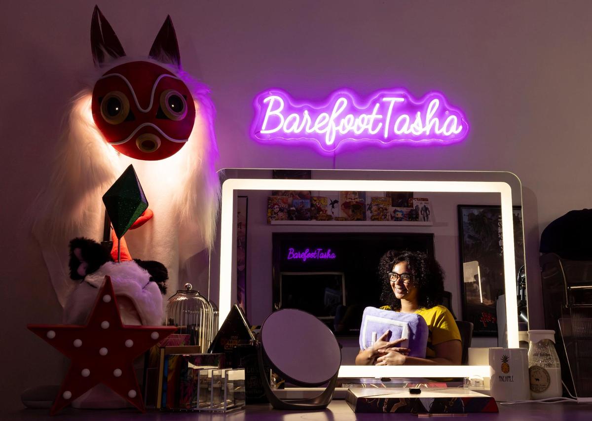 Natasha Walsh, a Twitch streamer and social media influencer, is photographed at her home on Thursday, April 3, 2025, in Miami. Walsh, whose Twitch handle is BarefootTasha, streams for about five to six hours a day, five times a week, and has almost 40,000 followers on Twitch.